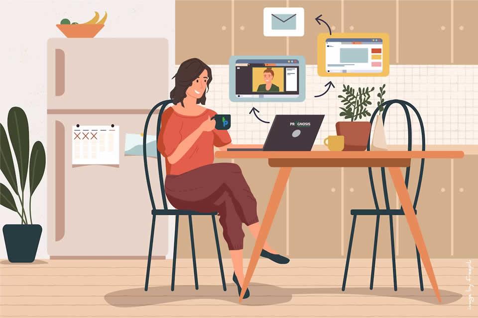 Woman working from home looking at a laptop on a desk.